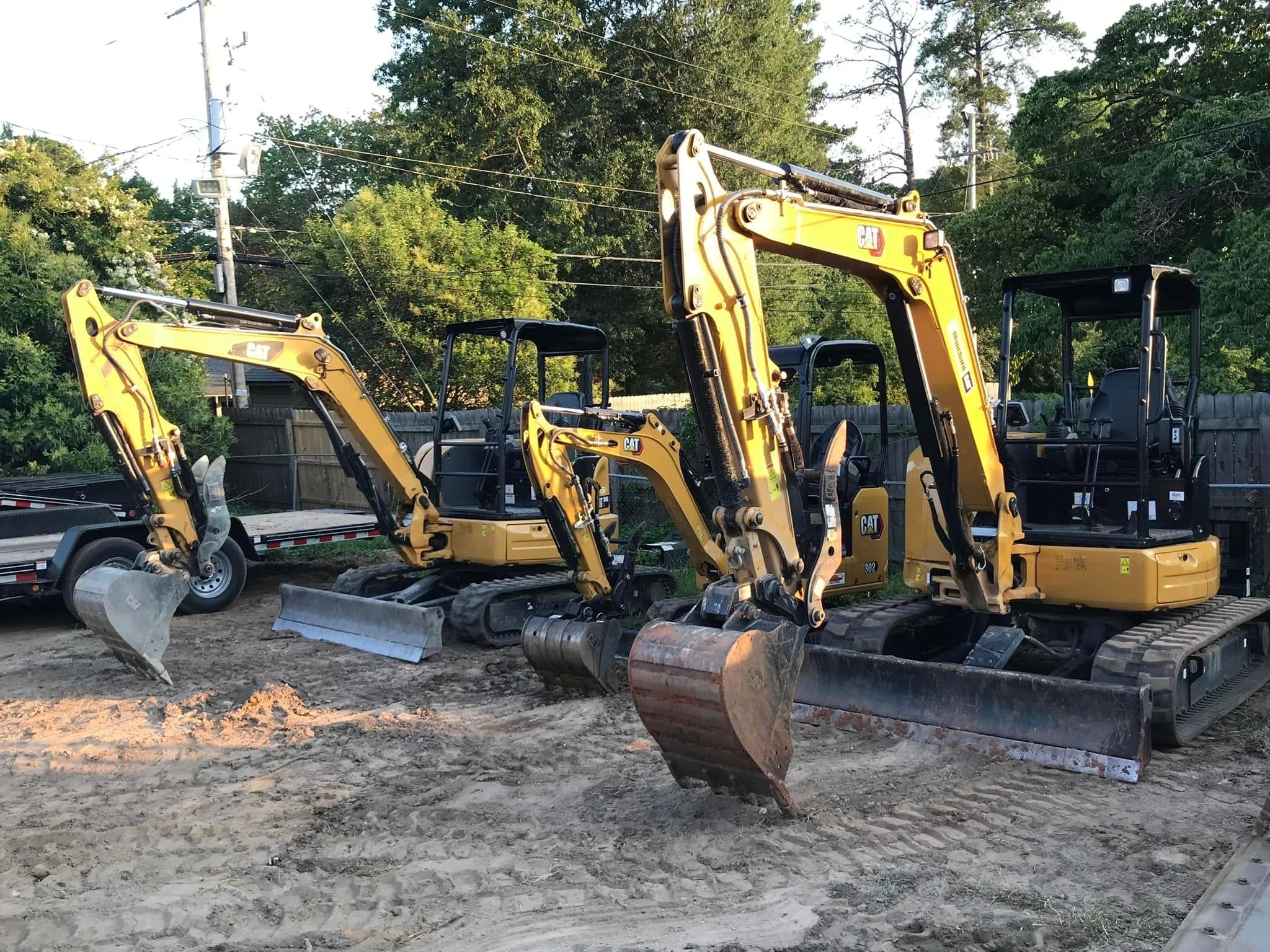 CAT excavator lineup equipment yard
